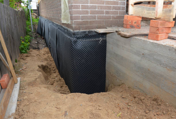 Happy homeowners after waterproofing job in Benedict